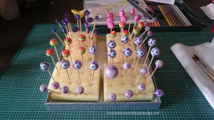 Fimo beads drying after varnishing.