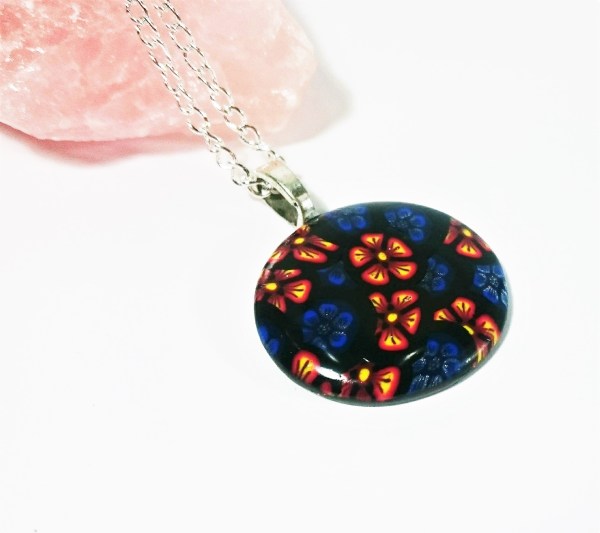 Polymer clay pendant made from two different flower canes