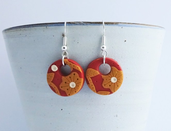 Burnt orange flower hoop earrings