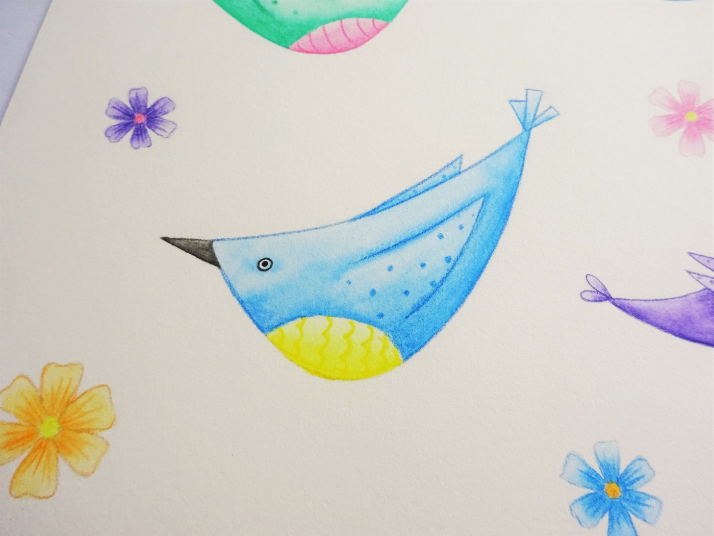 A blue watercolour pencil bird surrounded by flowers