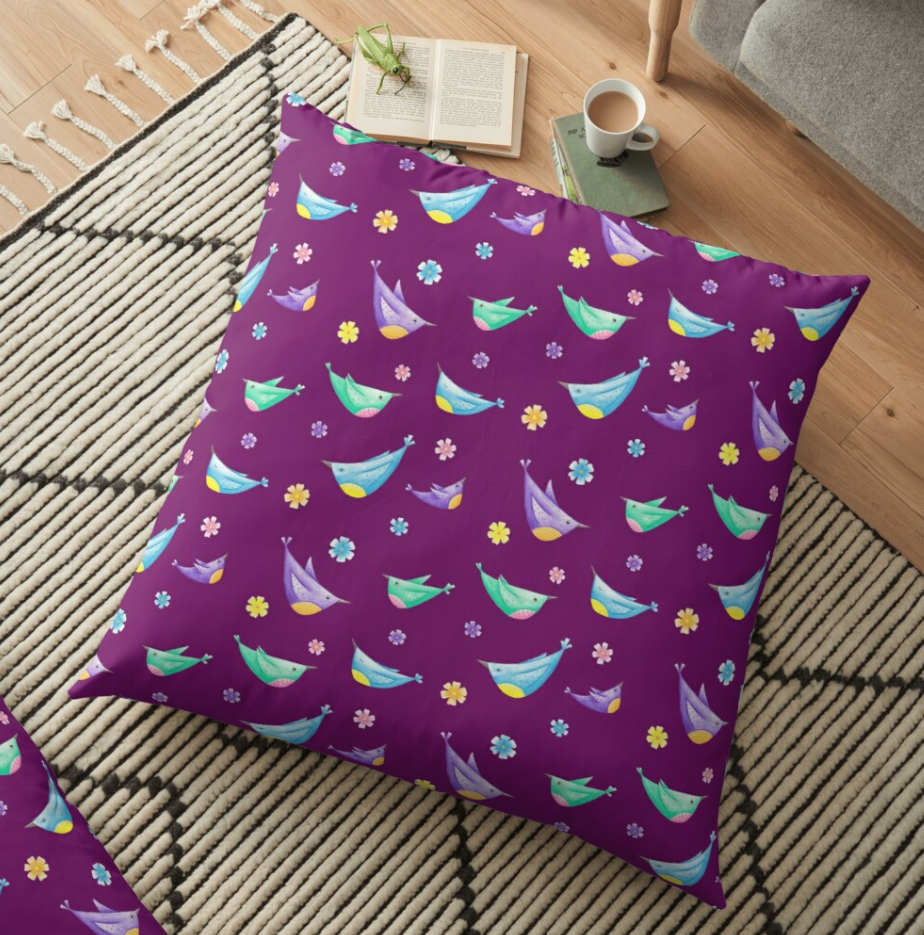 Colourful birds on a purple floor cushion