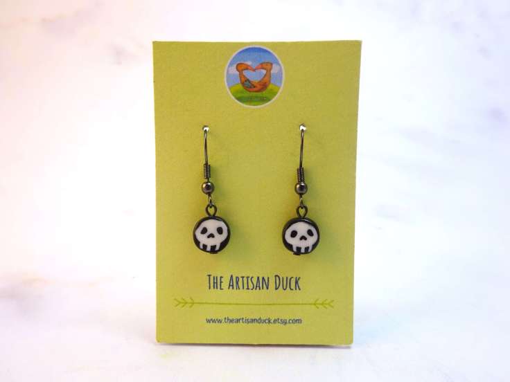 Black and white skull earrings.