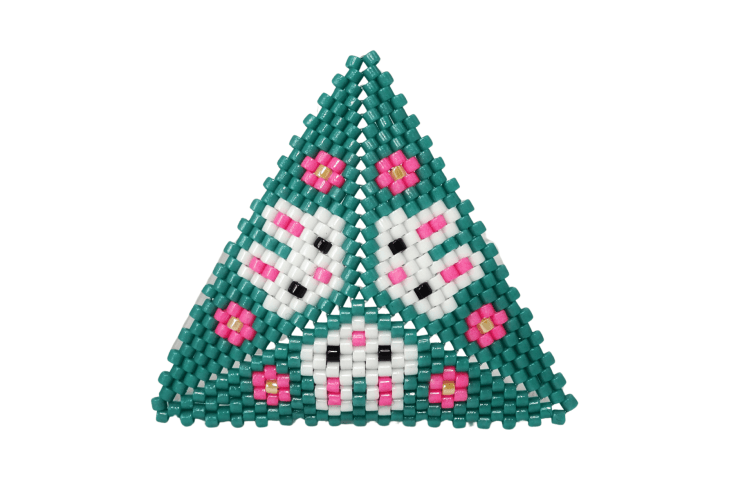 A Peyote triangle with three rabbit heads and pink flowers against a white background.