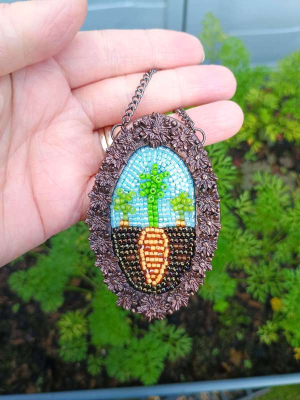 Carrot bead embroidery alongside my carrots growing in my garden