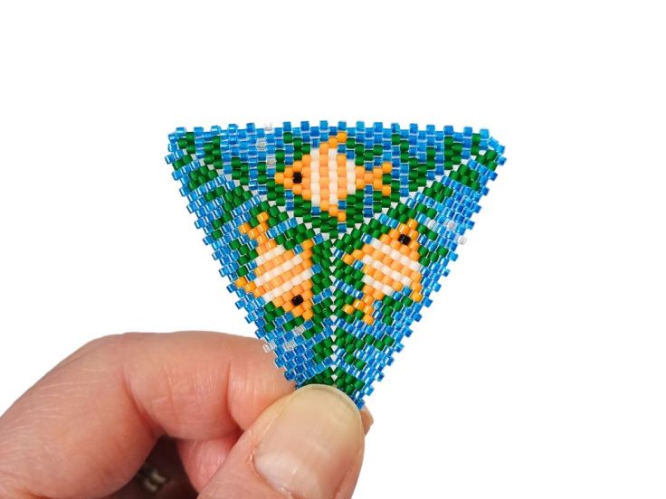 A peyote triangle with fish design