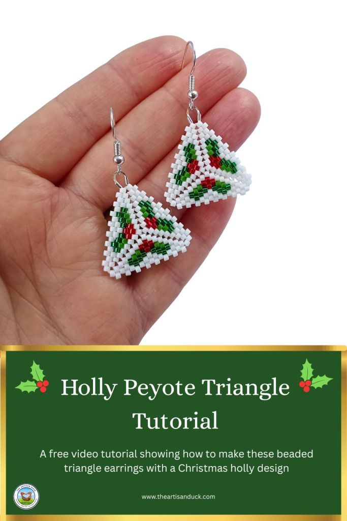 A beaded peyote triangle with holly design.