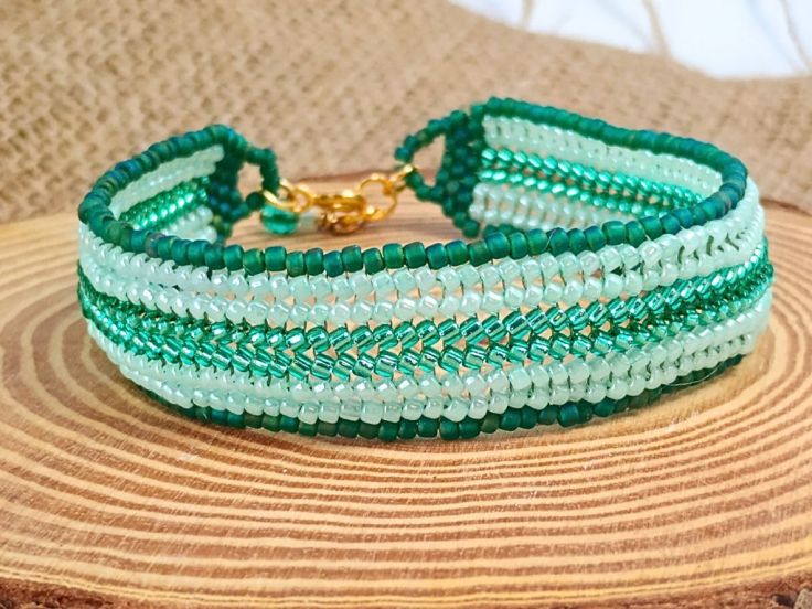 A herringbone stitch seed bead bracelet with brick stitch fastening.