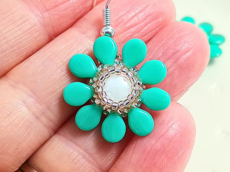 Pip and candy bead flower earrings with a seed bead bezel