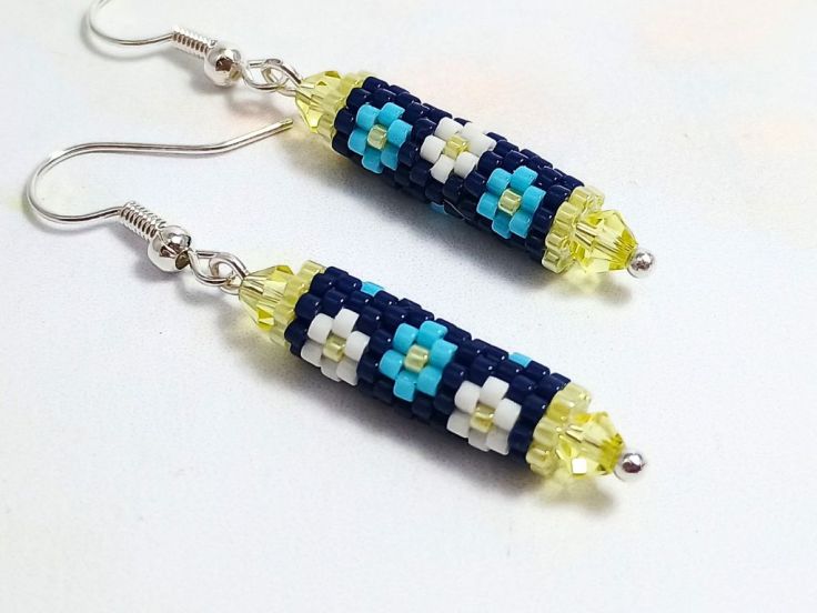 Tubular brick stitch earrings with a floral design