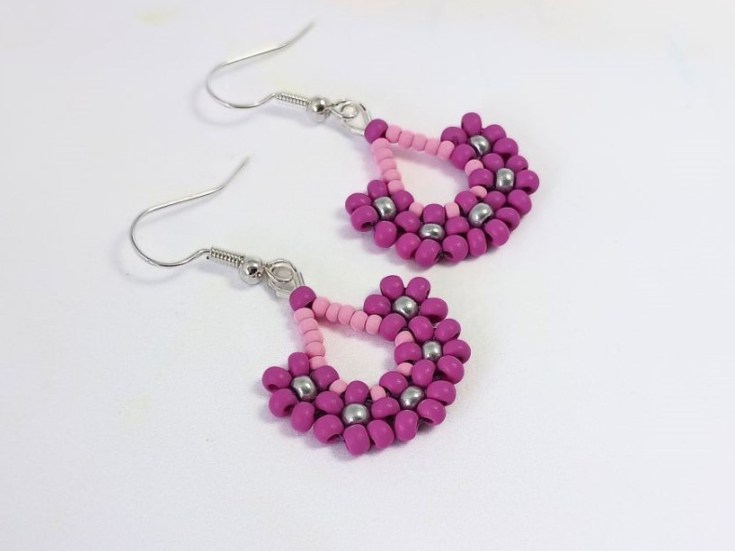 Seed bead flower drop earrings against a white background