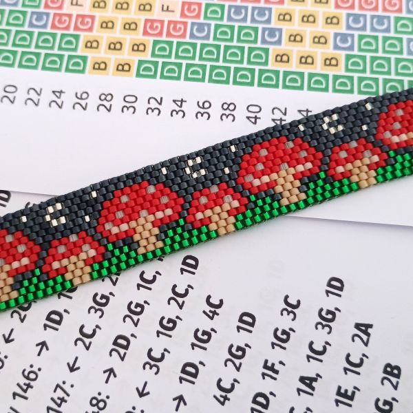 Peyote mushroom bracelet sitting on the beading pattern to make it